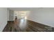 Bright living room featuring hard surface floors, fresh neutral paint and a gas fireplace at 722 Overlook Rd, Lowell, NC 28098