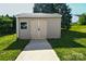 Exterior of the shed features siding, and double doors on a concrete walkway at 722 Overlook Rd, Lowell, NC 28098