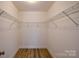 Walk-in closet providing plenty of storage with wire shelving and hard surface floors at 722 Overlook Rd, Lowell, NC 28098