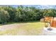 Spacious backyard featuring lush greenery, a wooden deck, storage shed, and room for outdoor activities at 803 Irene Ave, Kannapolis, NC 28083
