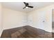 Serene bedroom featuring hardwood floors, a built-in bookshelf, and two closets for ample storage at 803 Irene Ave, Kannapolis, NC 28083