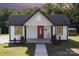 Inviting home exterior featuring a classic design, lush landscaping, and a welcoming front porch at 803 Irene Ave, Kannapolis, NC 28083