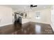 Bright and airy living room with hardwood floors seamlessly flows into a modern kitchen at 803 Irene Ave, Kannapolis, NC 28083