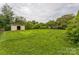 Large backyard with shed and green grass at 1019 Carmel Dr, Gastonia, NC 28056