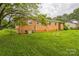 Backyard with brick house and chain link fence at 1019 Carmel Dr, Gastonia, NC 28056