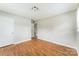 Bright bedroom features hardwood floors, closet, and neutral paint at 1019 Carmel Dr, Gastonia, NC 28056