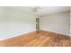 This bedroom is bright and features original hardwood flooring and neutral walls at 1019 Carmel Dr, Gastonia, NC 28056