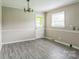 Bright and airy room featuring hardwood floors and a light-colored painted wall at 1019 Carmel Dr, Gastonia, NC 28056