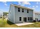 Rear exterior of a two-story home shows a patio and well-manicured lawn, perfect for outdoor living at 11195 Argosy Dr # 1098, Lancaster, SC 29720