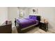 Cozy bedroom featuring purple bedding, soft lighting, and a view of the outside at 11195 Argosy Dr # 1098, Lancaster, SC 29720