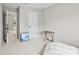 Neutral bedroom with a chaise lounge and view to another room through an open doorway at 11195 Argosy Dr # 1098, Lancaster, SC 29720