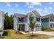 Charming two-story home featuring a two-car garage, light blue siding, manicured lawn and welcoming entrance at 11195 Argosy Dr # 1098, Lancaster, SC 29720