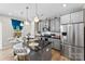 Modern kitchen features granite countertops, stainless steel appliances, pendant lighting, and counter seating and window at 11195 Argosy Dr # 1098, Lancaster, SC 29720
