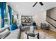 Open-concept living area boasts hardwood floors, modern decor, and a seamless flow into the kitchen and stairs at 11195 Argosy Dr # 1098, Lancaster, SC 29720