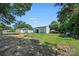 Large backyard with detached garage, additional outbuilding, and wooded perimeter at 1122 Oconee Ave, Rock Hill, SC 29732