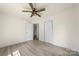 This bedroom has wood-look floors, a ceiling fan, and an attached closet at 1122 Oconee Ave, Rock Hill, SC 29732