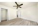Bedroom features wood-look floors, a ceiling fan, and closet with shelving at 1122 Oconee Ave, Rock Hill, SC 29732
