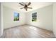 Inviting bedroom with new laminate flooring, ample natural light, and a modern ceiling fan for comfortable living at 1122 Oconee Ave, Rock Hill, SC 29732