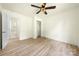 This bedroom features wood-look floors, closet, and access to an adjacent bathroom at 1122 Oconee Ave, Rock Hill, SC 29732