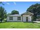 Quaint single-story home with a well-maintained lawn and inviting covered front porch with timber accents at 1122 Oconee Ave, Rock Hill, SC 29732