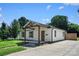 Charming single-story home featuring a covered porch with timber beams and a spacious concrete driveway at 1122 Oconee Ave, Rock Hill, SC 29732