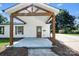 Inviting front porch with sturdy timber posts and beams, offering a warm welcome to this cozy home at 1122 Oconee Ave, Rock Hill, SC 29732