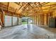 Large garage interior, featuring high ceiling, concrete floor and door with access to the backyard at 1122 Oconee Ave, Rock Hill, SC 29732