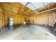 Spacious garage interior with wood framing, concrete floors, and ample room for vehicles and storage at 1122 Oconee Ave, Rock Hill, SC 29732