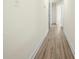 Hallway with wood-look floors leading to other rooms in the home at 1122 Oconee Ave, Rock Hill, SC 29732