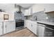 Bright kitchen featuring new stainless steel appliances, granite countertops, and white cabinets, ready for entertaining at 1122 Oconee Ave, Rock Hill, SC 29732
