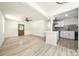 Open-concept living area with a modern kitchen featuring a breakfast bar and stainless steel appliances at 1122 Oconee Ave, Rock Hill, SC 29732