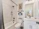 Well-lit bathroom with a tub-shower combo, vanity with a white countertop, and sleek fixtures at 1223 E 16Th St # 13, Charlotte, NC 28205