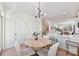 Bright dining area features modern lighting, table and chairs, and white walls at 1223 E 16Th St # 13, Charlotte, NC 28205