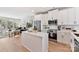 Modern kitchen with stainless steel appliances, island, white cabinets and natural light at 1223 E 16Th St # 13, Charlotte, NC 28205