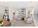 Cozy bonus room with armchairs, a bookshelf, kitchenette and a view to an ensuite bathroom at 1223 E 16Th St # 13, Charlotte, NC 28205