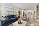 Modern living room with comfortable seating, neutral decor, and open concept to kitchen at 1223 E 16Th St # 13, Charlotte, NC 28205
