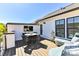Outdoor patio with a table, four chairs and a lounge seating area with a TV at 1223 E 16Th St # 13, Charlotte, NC 28205