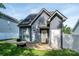 A well maintained backyard that features a patio area, privacy fence, and a fire pit at 1226 Rising Oak Dr, Charlotte, NC 28206