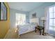 Bright bedroom with carpet, natural light from two windows, and ample closet space at 1226 Rising Oak Dr, Charlotte, NC 28206