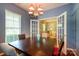 Elegant dining room with a dark wood table and a view into the living room at 1226 Rising Oak Dr, Charlotte, NC 28206