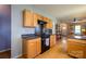 Open kitchen featuring stainless steel appliances, hardwood floors and easy access to living area at 1226 Rising Oak Dr, Charlotte, NC 28206