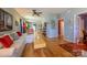 Open living space with hardwood floors and a modern ceiling fan at 1226 Rising Oak Dr, Charlotte, NC 28206