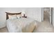 Bedroom features a bed, a lamp, pillows, and a closet at 12415 Stratfield Place Cir, Pineville, NC 28134