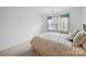 Bedroom with a bed, pillows, and a window at 12415 Stratfield Place Cir, Pineville, NC 28134