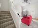 Bright living room featuring stairs, high ceilings, a fireplace, a large window, and comfortable seating at 12415 Stratfield Place Cir, Pineville, NC 28134