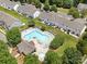 Aerial view of the community pool and surrounding green space at 12415 Stratfield Place Cir, Pineville, NC 28134
