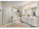 Bright bathroom with a large soaking tub, glass shower, double vanity, and a window to let in natural light at 138 Blandina Ct, Fort Mill, SC 29708