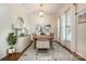Elegant dining room with a decorative chandelier, large windows, and stylish furnishings at 138 Blandina Ct, Fort Mill, SC 29708