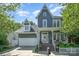 Charming two-story home with a covered porch, a two-car garage, and a beautifully landscaped front yard at 138 Blandina Ct, Fort Mill, SC 29708