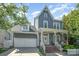 Charming two-story home with a covered porch, a two-car garage, and a beautifully landscaped front yard at 138 Blandina Ct, Fort Mill, SC 29708